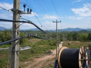 Aerial bundled cable installed on rural distribution poles with cable drum preparation