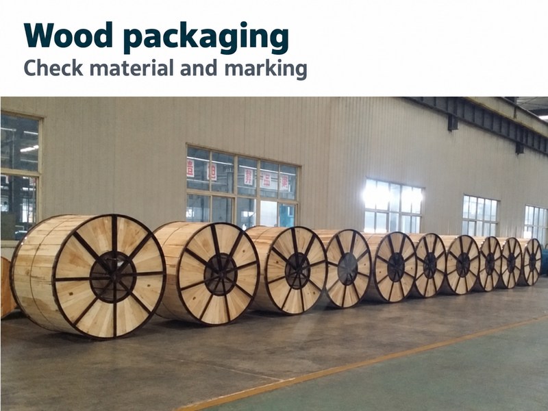 Wooden reel reference photograph with a reminder to check packaging material and marking